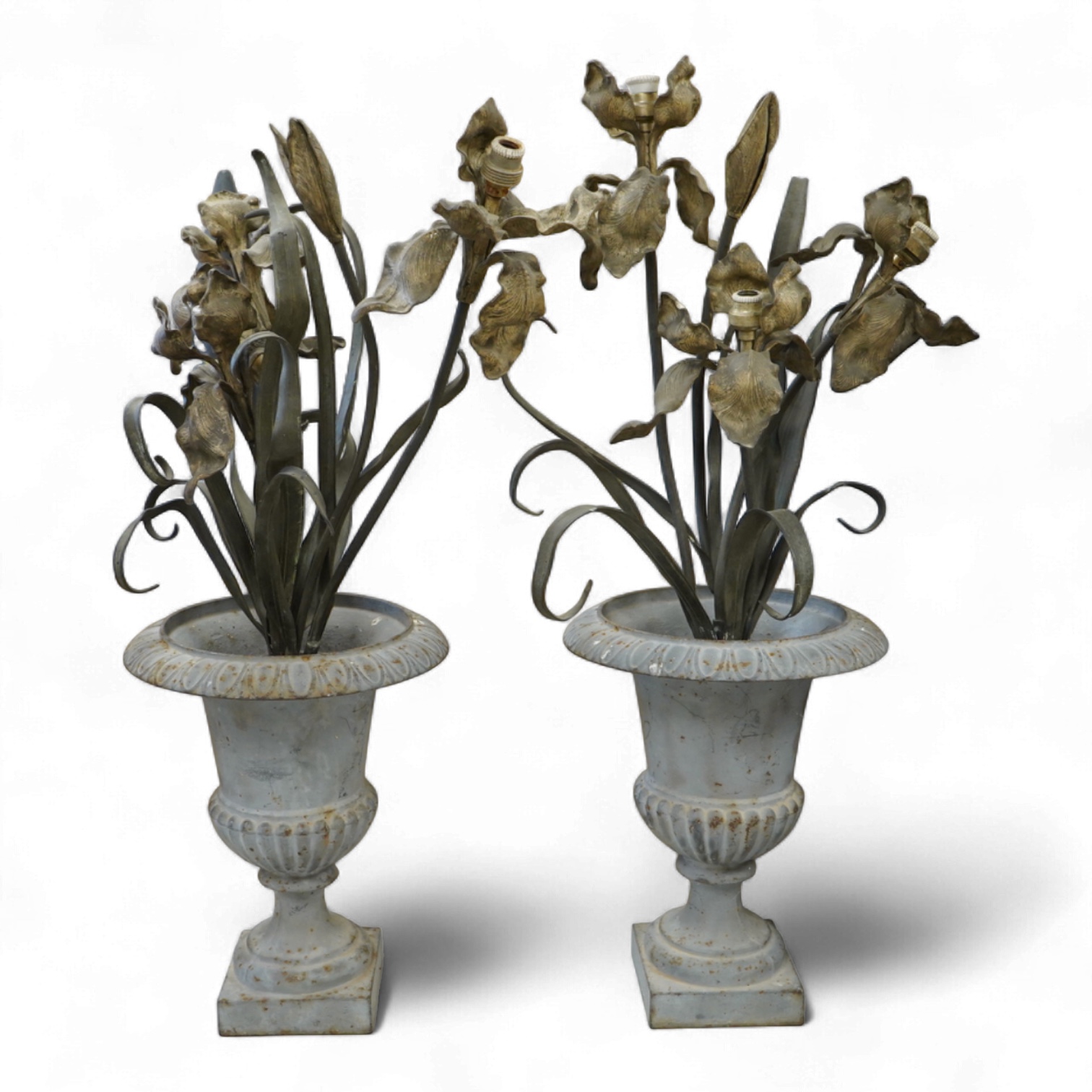 A pair of cold painted bronze floral lamps with painted cast iron campagna urns, 76cm high